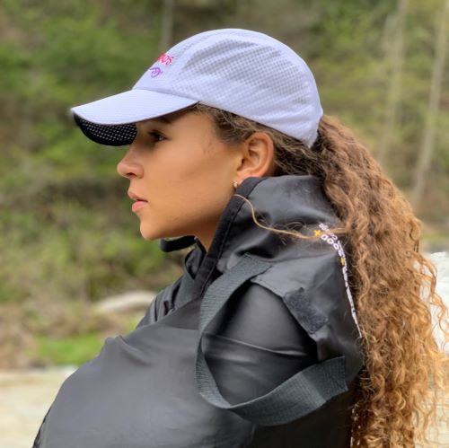 girl wearing winter ponytails caps