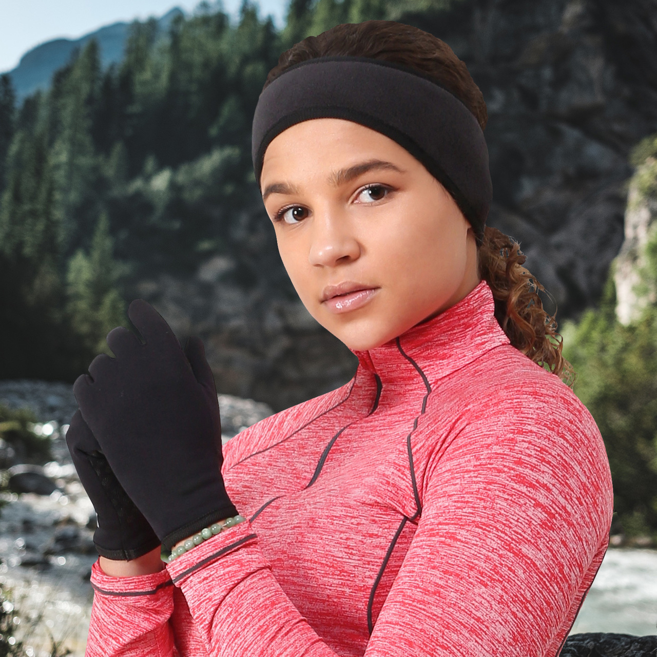 Woman wearing TrailHeads winter running gloves and headband