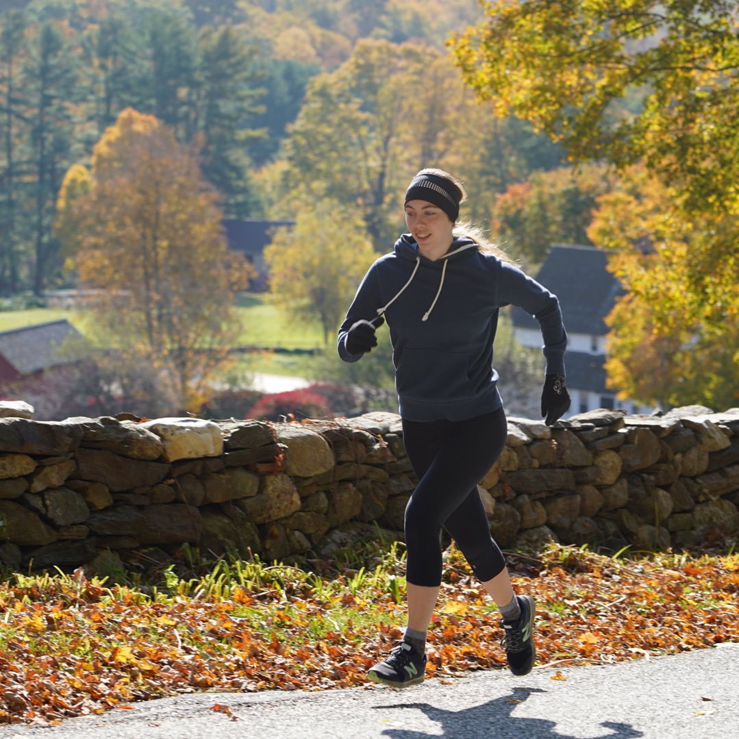 Woman wearing winter running gloves and beanie